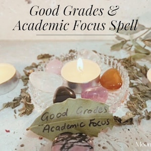 May include: A mystical arrangement with lit candles, crystals, and a leaf inscribed with "Good Grades & Academic Focus." The scene includes a variety of colourful stones and dried herbs, creating a spiritual ambiance.