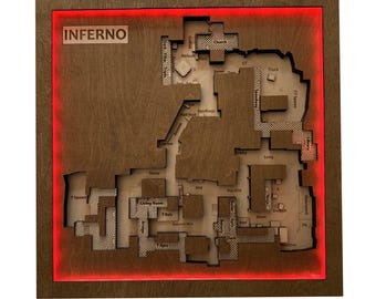 May include: A wooden map of the Inferno level from a video game, with the word "INFERNO" at the top. The map is brown with etched details and a red LED border. The map includes labeled areas like "Church" and "Truck".
