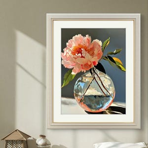 May include: A single pink peony flower in a clear glass vase with a round base. The vase is filled with water and the flower is partially submerged. The background is a dark blue.