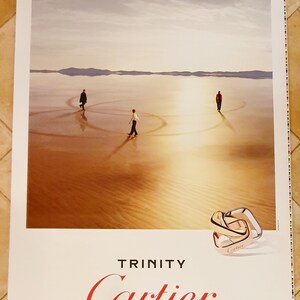 Wandposter 120 x 176 Cartier Trinity Visual 1 gerollt