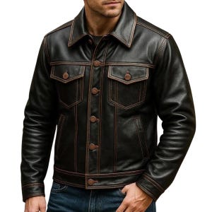 May include: Black leather jacket with brown stitching and button closure. The jacket has two chest pockets and two side pockets. The collar is a classic fold-down style. A stylish outerwear piece.