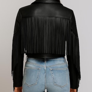 Women’s brown sheepskin leather fringe jacket with Western rodeo design and zip closure