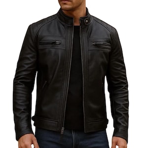 mens black leather jacket in cafe racer biker design with quilted shoulders and front zip closure against white background
