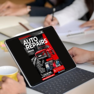 May include: A tablet displaying a red and black advertisement for auto repairs. The ad features a red car, a list of services, a phone number, and the website address "www.yourwebsitehere.com".