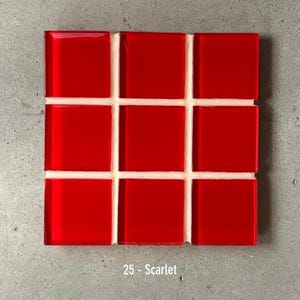 May include: A square mosaic tile sheet featuring nine glossy, square red tiles. The tiles are arranged in a 3x3 grid, separated by white grout. The text "25 - Scarlet" is at the bottom.