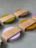 Felt Coasters Set 0f 4 – Handmade from New Zealand Wool – Round 10 cm –  Soft, Stylish & Durable - Colorful coasters - Housewarming Gift product logo
