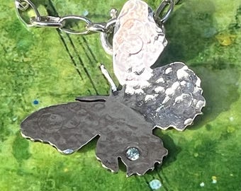 Sterling silver handmade butterfly pendant with flush set cubic zirconia, hallmarked in Edinburgh