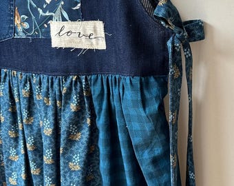 Navy blue tunic pinafore with patchwork and appliqué