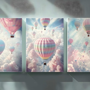 May include: A set of three canvas prints featuring colourful hot air balloons floating in a sky filled with fluffy pink clouds.