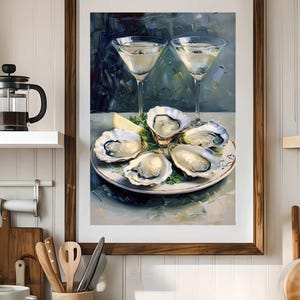 May include: A framed painting depicts a culinary scene. A plate of oysters, garnished with parsley and lemon, sits beneath two martini glasses. The artwork is set against a dark, abstract background.