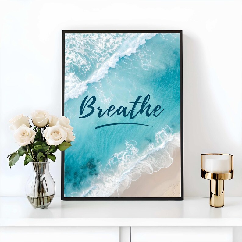 Let the sea remind you to breathe.
This peaceful digital wall art features the word “Breathe” overlaid on a stunning aerial view of turquoise ocean waves crashing onto the shore. It’s a perfect reminder to slow down, take a deep breath, and reconnect with calmness.

Whether you’re curating a beach-themed room, designing a yoga or meditation space, or just need a moment of serenity in your home or office—this printable is a gentle and stylish touch.
