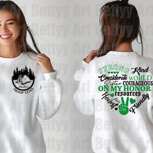 May include: White sweatshirt with a camping design on the front and text on the back. The front features a tent and trees with the text "Troop 12345". The back has a green heart with words like "Strong", "Kind", and "Friendly".