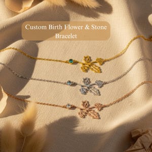 May include: Three delicate bracelets with floral designs and gemstones. The bracelets are gold, silver, and rose gold. Each bracelet features a flower design with a gemstone accent. The text "Custom Birth Flower & Stone Bracelet" is at the top.