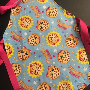 May include: A set of three ceramic mugs with a speckled, matte finish. The mugs are in shades of gray, white, and black. Each mug has a simple, modern design and a rounded handle. The mugs are likely for coffee or tea.