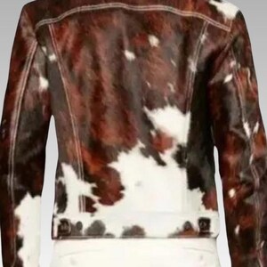 Men’s Western cowhide leather jacket made from hair-on pony hide, featuring a bold black and white cow print and front zipper closure.