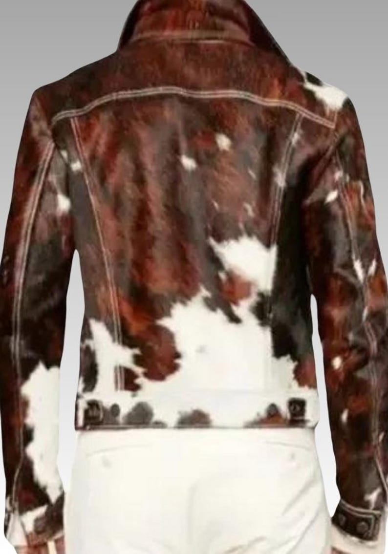 Men’s Western cowhide leather jacket made from hair-on pony hide, featuring a bold black and white cow print and front zipper closure.