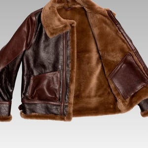 Front view of sheepskin leather jacket with soft faux shearling lining, zip closure, and timeless winter fashion design.