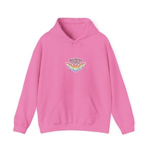 May include: A bright pink hoodie with a kangaroo pocket and drawstring hood. The front features a colorful bat graphic with the text "Spooky and Valid". The graphic has rainbow wings and a smiling face.