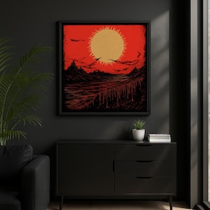 May include: Framed artwork featuring a stylized landscape with a large, golden sun against a red sky. The artwork depicts mountains, water, and a dripping effect, all in shades of red and black. The artwork is displayed on a black wall.