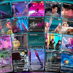 May include: A collection of custom trading cards featuring stylized artwork and text. The cards showcase various characters and scenes with vibrant colors and unique designs. The text "SajA Boys" is visible on one of the cards.