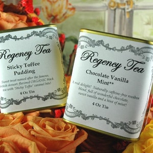 May include: Two 4-ounce tins of Regency Tea. The tin on the left is labeled "Sticky Toffee Pudding" and the tin on the right is labeled "Chocolate Vanilla Mint". Both tins are gold with white labels and are surrounded by orange roses.