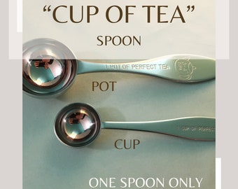May include: Two tea spoons, one large and one small, with the text "CUP OF TEA" and "ONE SPOON ONLY". The larger spoon is labeled "POT" and the smaller spoon is labeled "CUP". The spoons are light green with silver measuring cups.