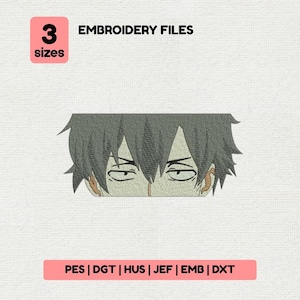 May include: A white ceramic mug with a black handle and the text "But First, Coffee" in a bold, black font. The mug is set against a blurred background, suggesting a cozy setting.