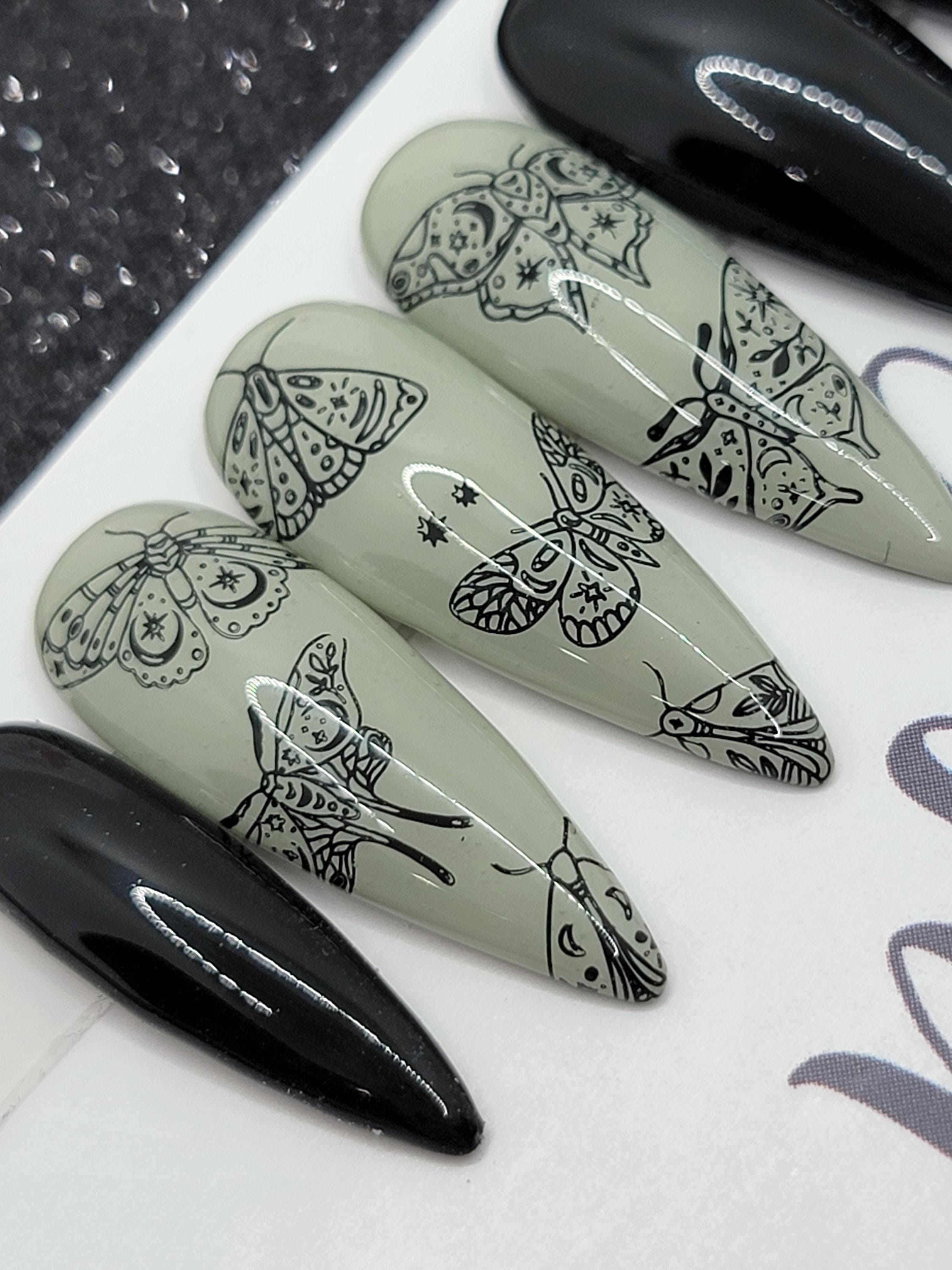 Edgy Black Faux Moth Nail Design