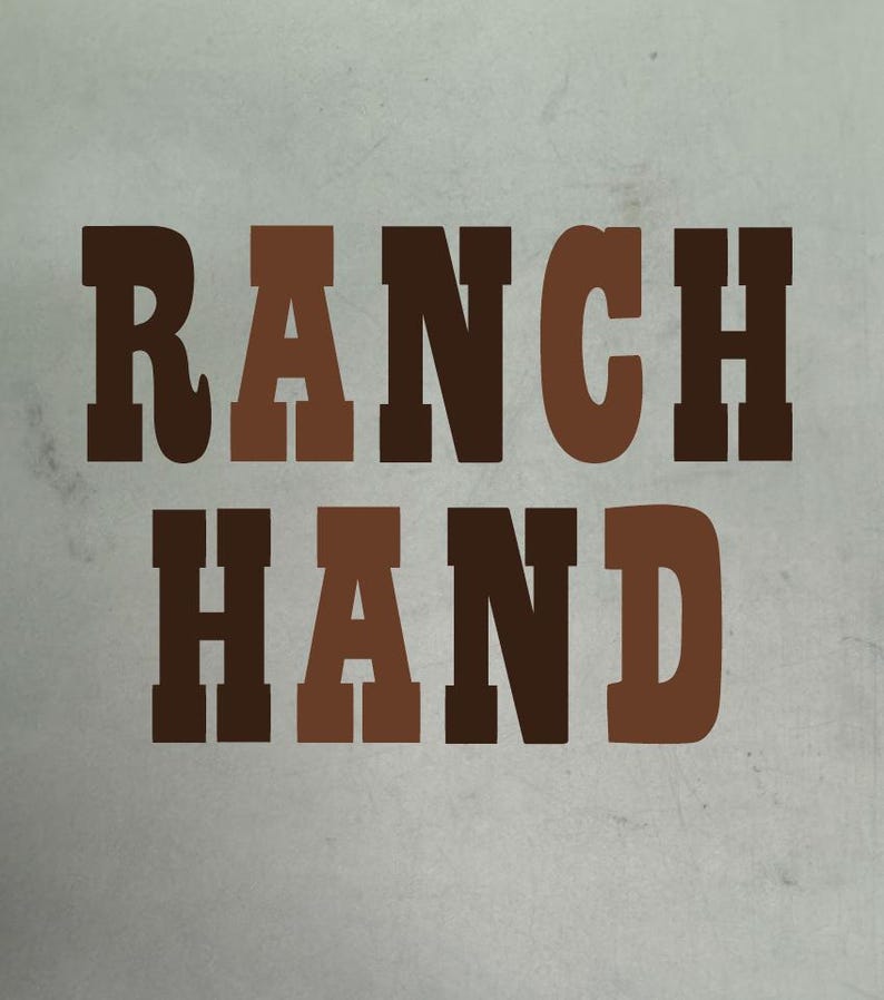 May include: The words "RANCH HAND" are displayed in a bold, blocky font. The text is in varying shades of brown against a light gray background. The design has a rustic, Western aesthetic.