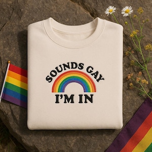 Sounds Gay I&#39;m In Embroidered Sweatshirt – Funny Pride Rainbow LGBT Shirt – LGBTQIA+ Gay Gift Idea – Queer Affirmation Unisex Crewneck