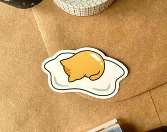 Egg Cat Sticker | Gudetama inspired, Cat lovers gift, Sleepy cat, Lazy cat, Glossy Vinyl Sticker