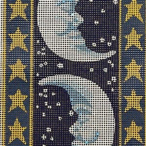 May include: A needlepoint canvas with a design of four crescent moons and stars on a dark blue background. The moons are white with a blue tint and the stars are yellow.