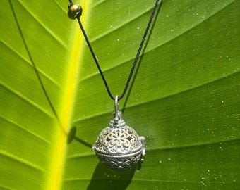 long filigree cage locket pendant