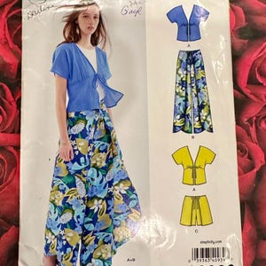 May include: New Look sewing pattern D0939 for a tie-front top and wide-leg pants or shorts. The envelope displays a blue tie-front top with a white undershirt and floral print pants in shades of blue, green, and white, plus yellow garment variations.