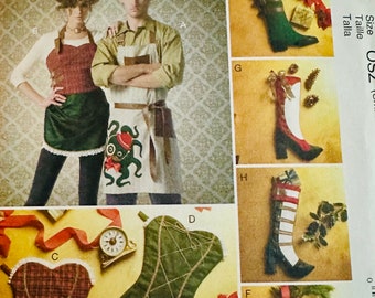 May include: A sewing pattern for a Christmas stocking, apron, and corset. The pattern includes instructions for making a boot-shaped stocking with a red, white, and green design, a green apron with an octopus design, and a green corset with a plaid design. The pattern is from McCall's Crafts and is size 052.