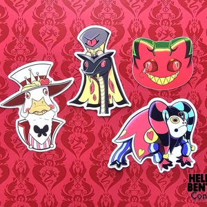 May include: Four character stickers on a red patterned background. The stickers feature cartoon characters with various designs, including a snake, a duck, a cat, and a jester. The stickers are white-bordered.