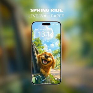 May include: A live wallpaper for a smartphone featuring a cartoon dog sticking its head out of a car window. The dog is smiling and has a brown and white coat. The background is a sunny day with a blue sky and green trees. The time on the phone screen is 13:14.