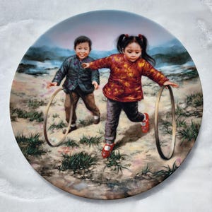 Cerchietti da collezione Bradford Exchange Rolling Hoops di Kee Fung Ng