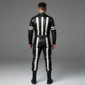 May include: Black leather jumpsuit with white vertical stripes down the front and back, and white stripes on the sleeves. The jumpsuit has a fitted waist and long sleeves. The model is facing away from the camera.