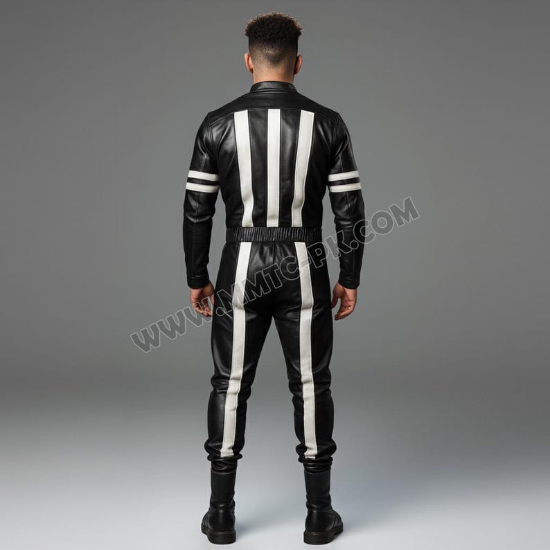 May include: Black leather jumpsuit with white vertical stripes down the front and back, and white stripes on the sleeves. The jumpsuit has a fitted waist and long sleeves. The model is facing away from the camera.