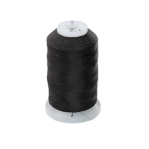 May include: A spool of black thread, ideal for sewing and crafting projects. The thread is tightly wound around a white plastic spool. The top of the spool is labeled with the letters "BLK".