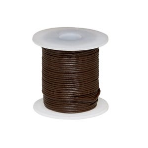 May include: A spool of dark brown leather cord wrapped tightly around a white plastic bobbin. The cord has a smooth, rounded texture and is wound in multiple even layers from the top to the bottom of the central cylindrical core.