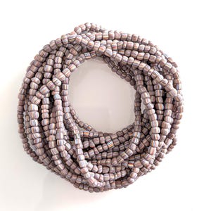 Java Trade Beads Striped Glass Beads 4 - 6mm Lilac Mixed Colors. Sold per 24 inch / 61 cm strand