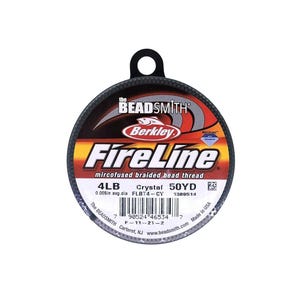 May include: A spool of black Berkley FireLine braided bead thread fishing line. The spool is labeled with the text "the BEADSMITH", "Berkley", "FireLine", "mircofused braided bead thread", "4LB", "Crystal", "50YD", "0.005in avg. dia", "FLBT4-CY", "1389514", "90524 46534", "F-11-21-2", "The BEADSMITH", "Carteret, NJ", "www.beadsmith.com", "Made in USA".