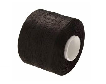 May include: A spool of black waxed thread for leather crafting.