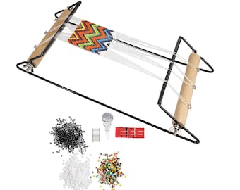 May include: A bead loom with a partially woven colourful zig-zag pattern. The loom is black with wooden rollers. Additional beads in black, white, and assorted colours are included, along with tools for beading.