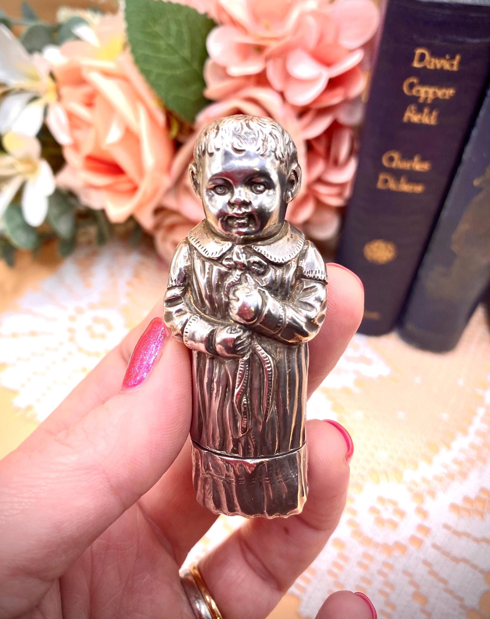 A Silver Pill Box with Embossed Fairy Decoration to Lid
