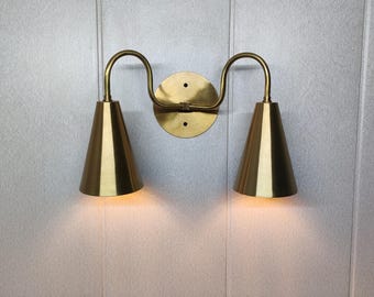 Raw Brass Double Arm Wall Sconce | Modern Brass Wall Light with Conical Shades | Mid-Century Wall Lamp