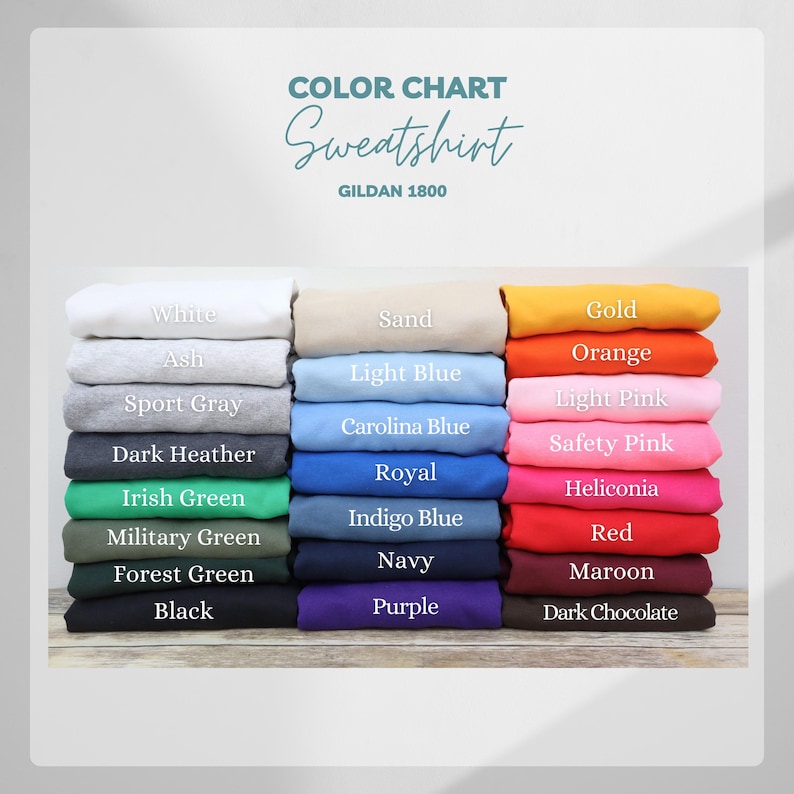 May include: Color chart of Gildan 1800 sweatshirts in various colors, including white, ash, sport gray, dark heather, Irish green, sand, light blue, Carolina blue, gold, orange, light pink, and more. The word "Sweatshirt" is written in cursive.
