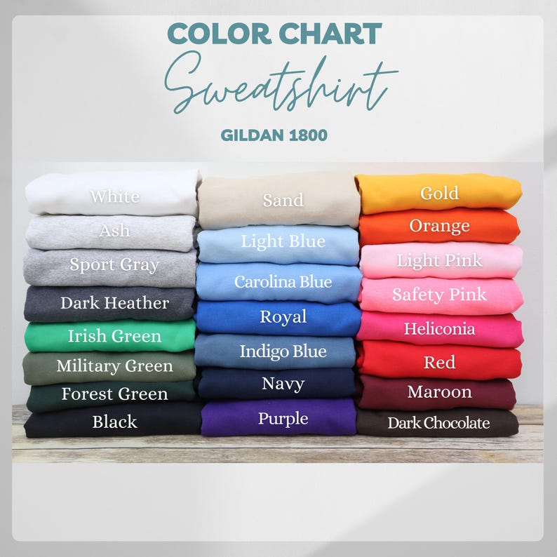 Op de afbeelding: Een kleurenkaart voor Gildan 1800 sweatshirts, met een verscheidenheid aan kleuren. De kaart bevat tinten als wit, zwart en marine, evenals levendige tinten zoals rood, oranje en roze. De tekst "KLEURENKAART Sweatshirt" staat bovenaan.